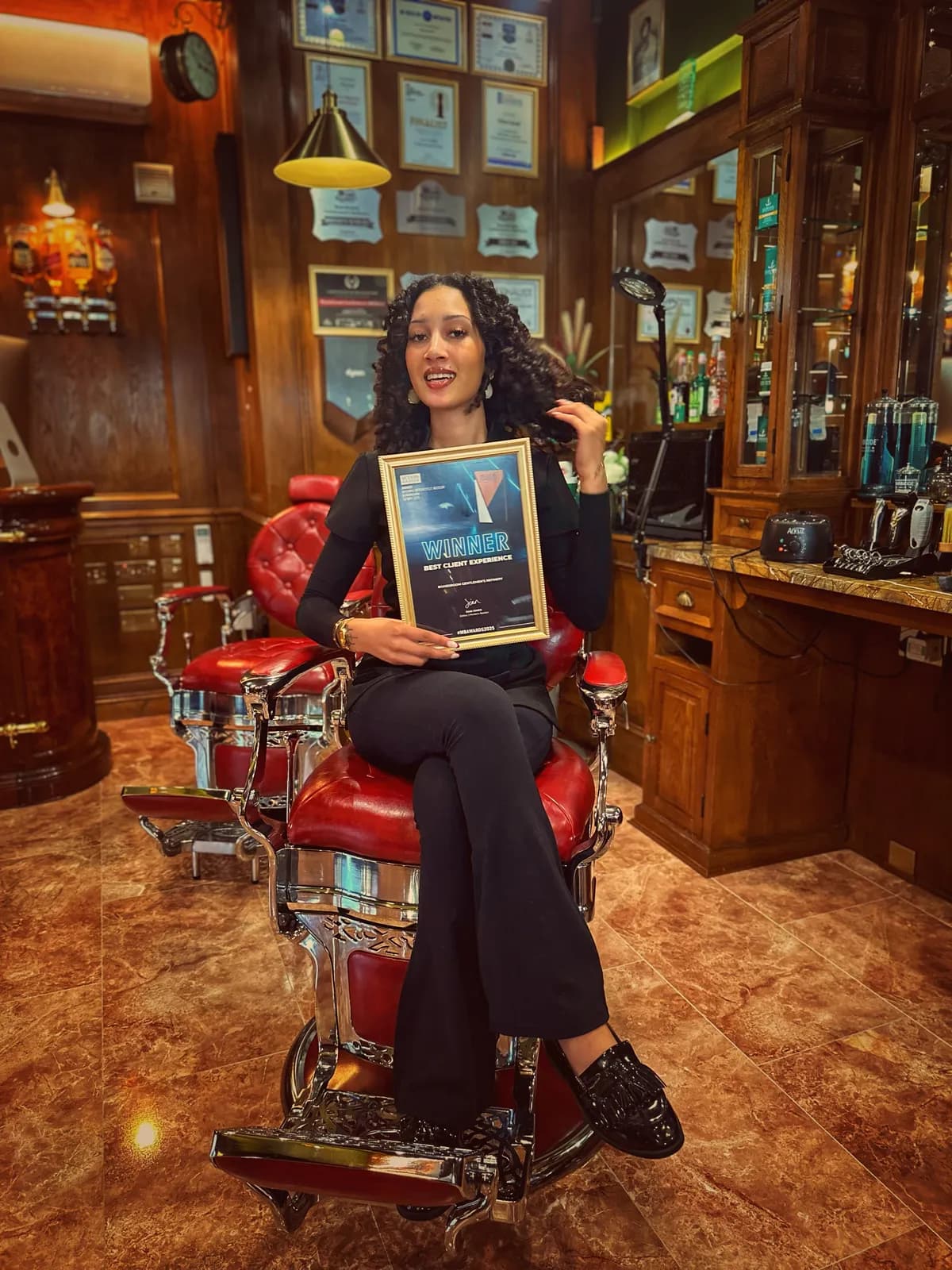A Boardroom team member with the Best Client Experience award
