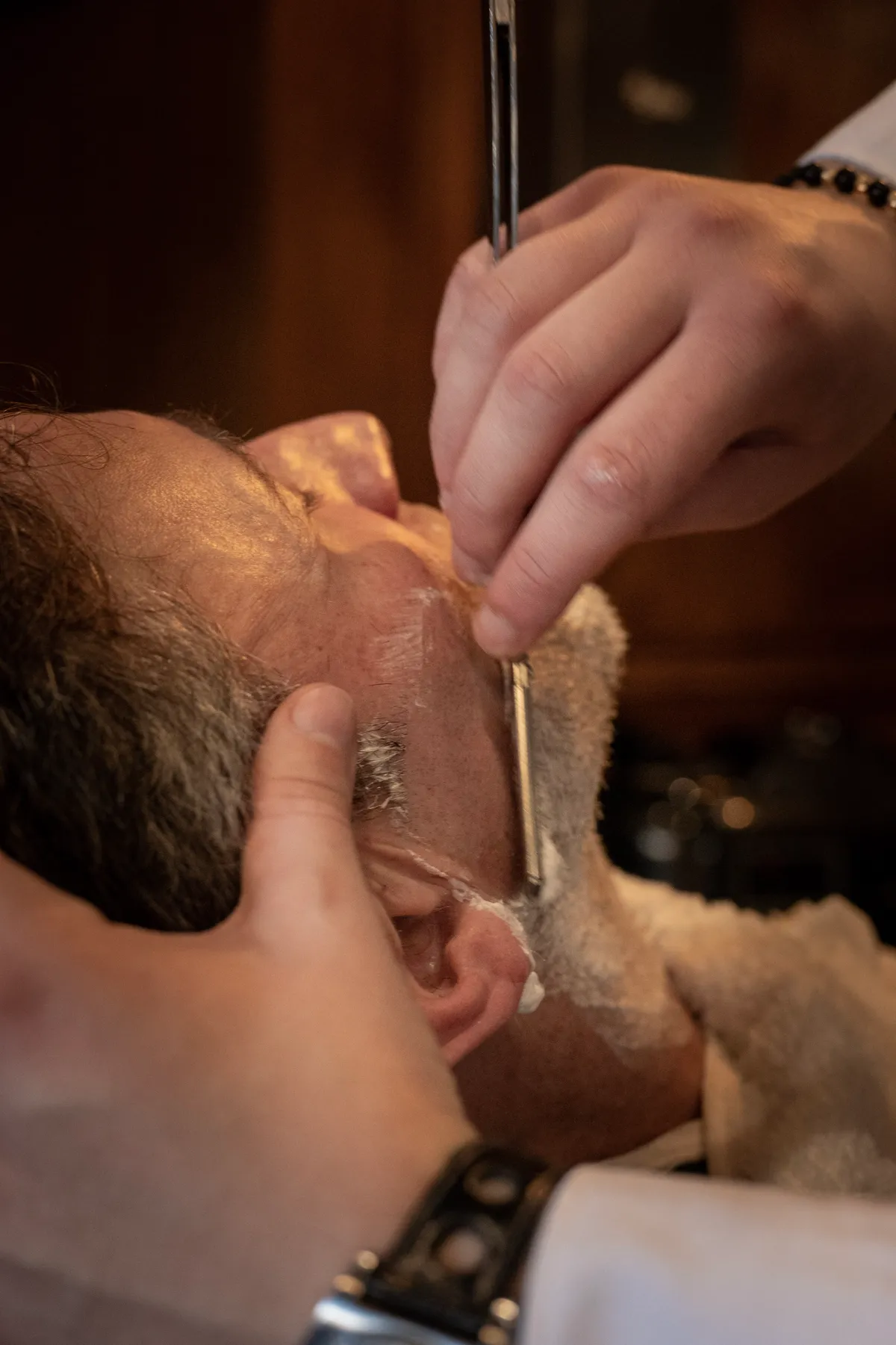 A cut-throat razor shave in progress